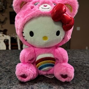 Hello Kitty Pink Plush dressed as a Care Bear with Rainbow Belly